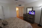 Main suite with flat screen HDTV and walk in closet